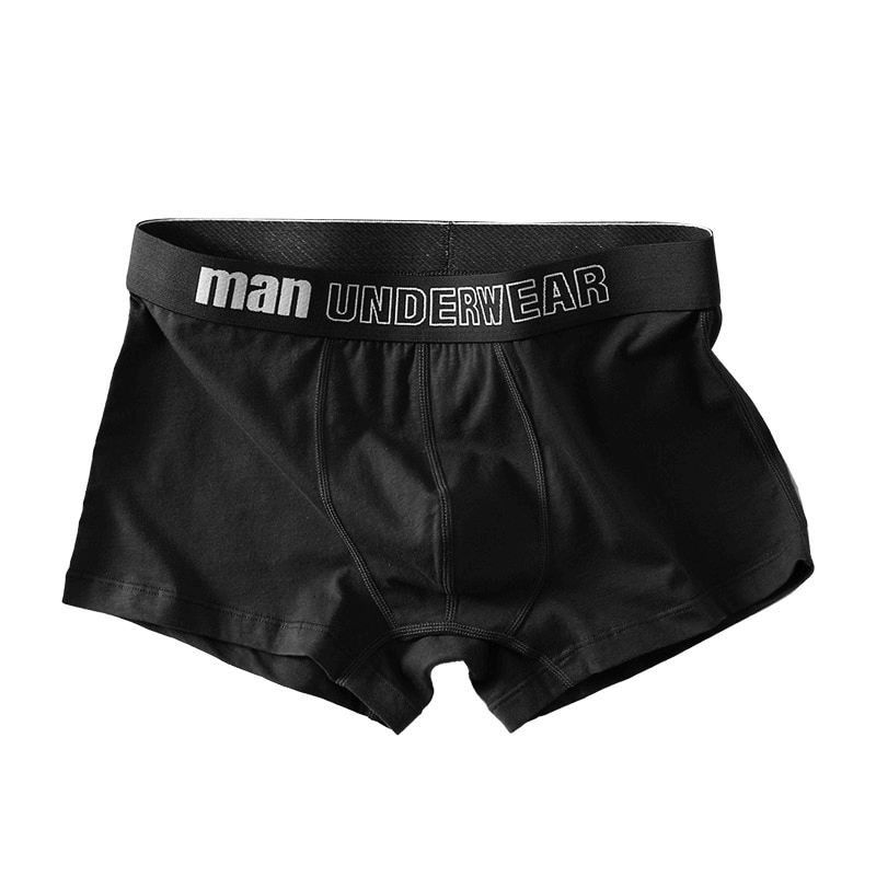 Black cotton male boxers with 'man' waistband design, showcasing solid color and comfortable fit for everyday wear.